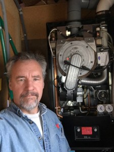 Karl working on a Hybritherm wall-mounted boiler